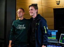 two people smiling in music studio