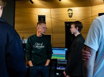 people discussing in the music studio