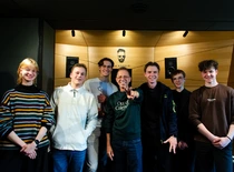 people posing in front of the camera