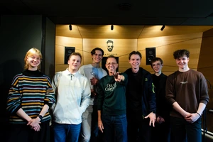 people posing in front of the camera