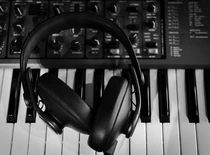 headphones on the piano