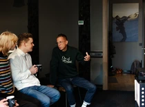 man discussing with others
