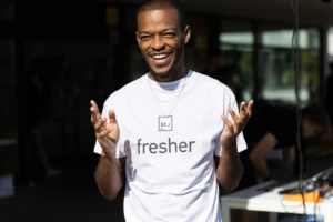 student with a white T-shirt saying "fresher"